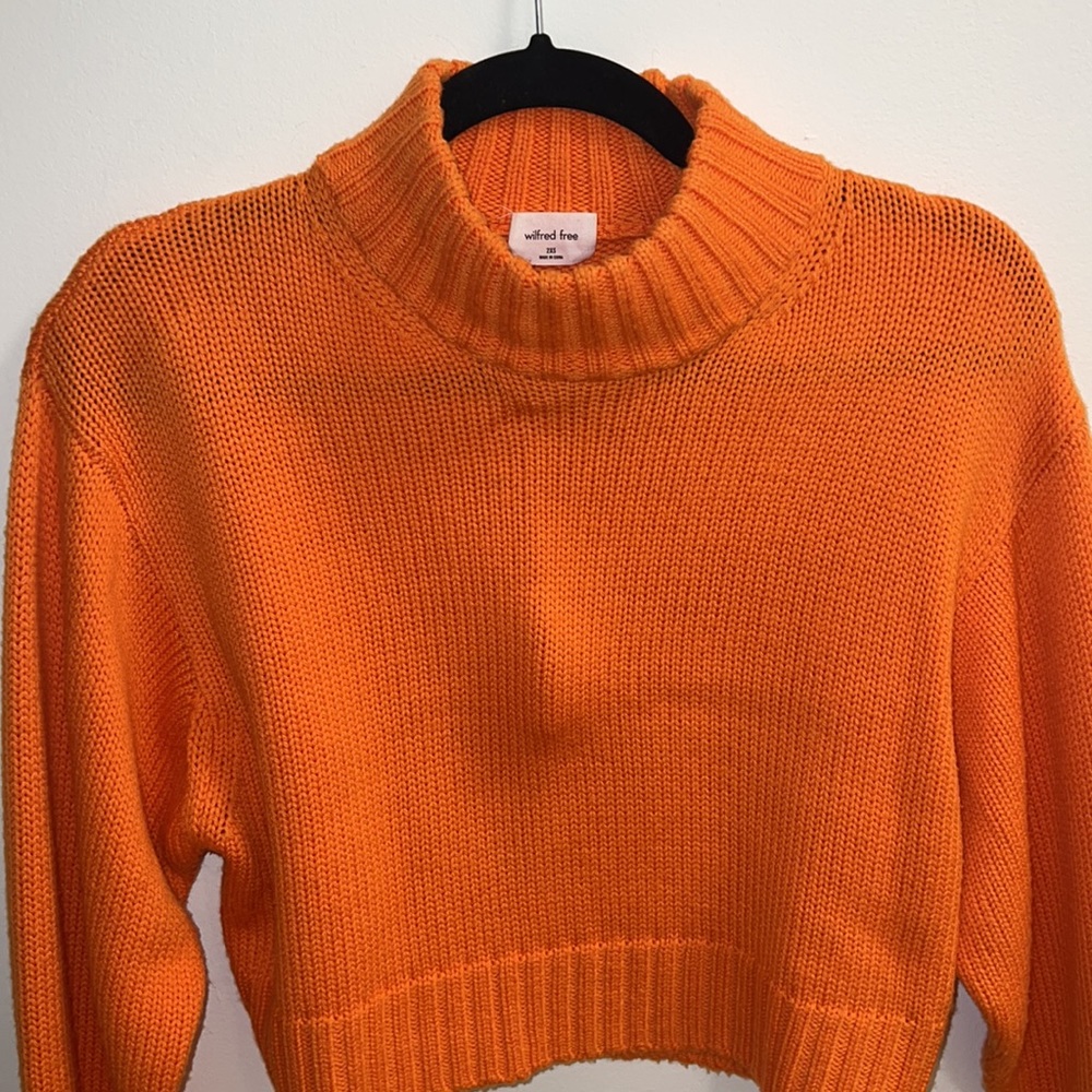 Neon orange slightly cropped turtleneck sweater from Aritzia
